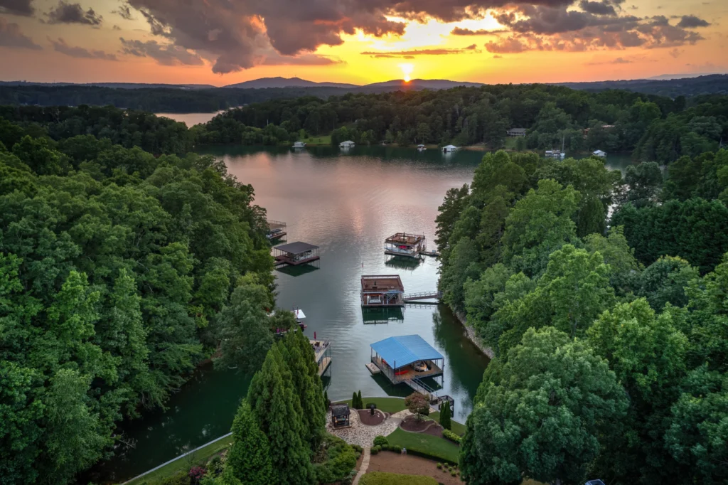 Aerial view of Lake Lanier at sunset with docks along a cove
